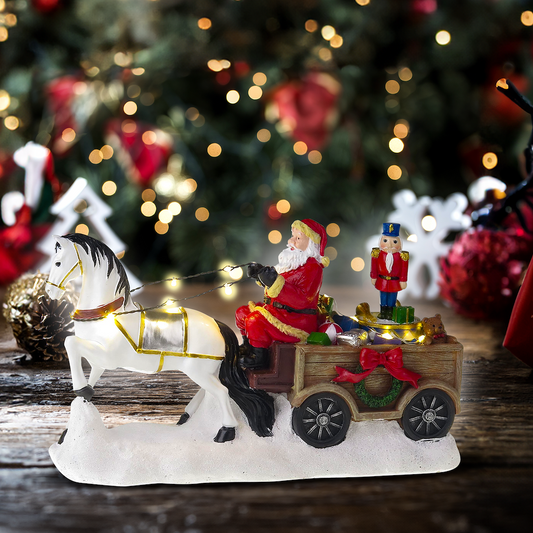 Święty Mikołaj z białym koniem, furgonem i obrotowym dziadkiem do orzechów